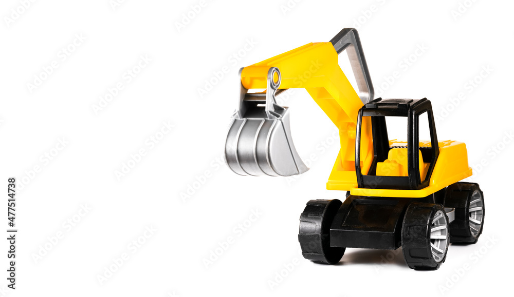 Fototapeta premium Yellow macro excavator toy on isolated white background