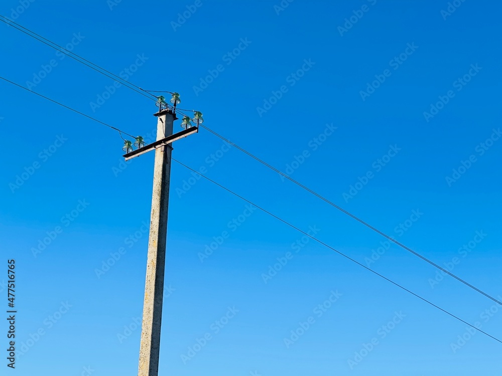 Closeup of old power line. Power transmission line pole with power lines attached Closeup of old power line. Power transmission line pole with power lines attached