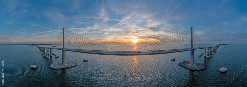 Drone panorama of Sunshine Skyway Bridge over Tampa Bay at sunset - obrazy, fototapety, plakaty 