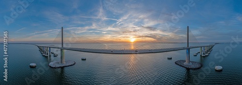 Drone panorama of Sunshine Skyway Bridge over Tampa Bay at sunset