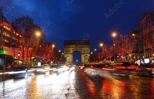 The famous Triumphal Arch and Champs Elysees avenue illuminated for Christmas 2021 ,Paris, France. photo