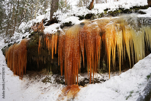 Beautiful natural icefalls with dark colours (Konirna, Brtnicke ledopady) is popular tourist attraction in Czech Republic in winter time photo