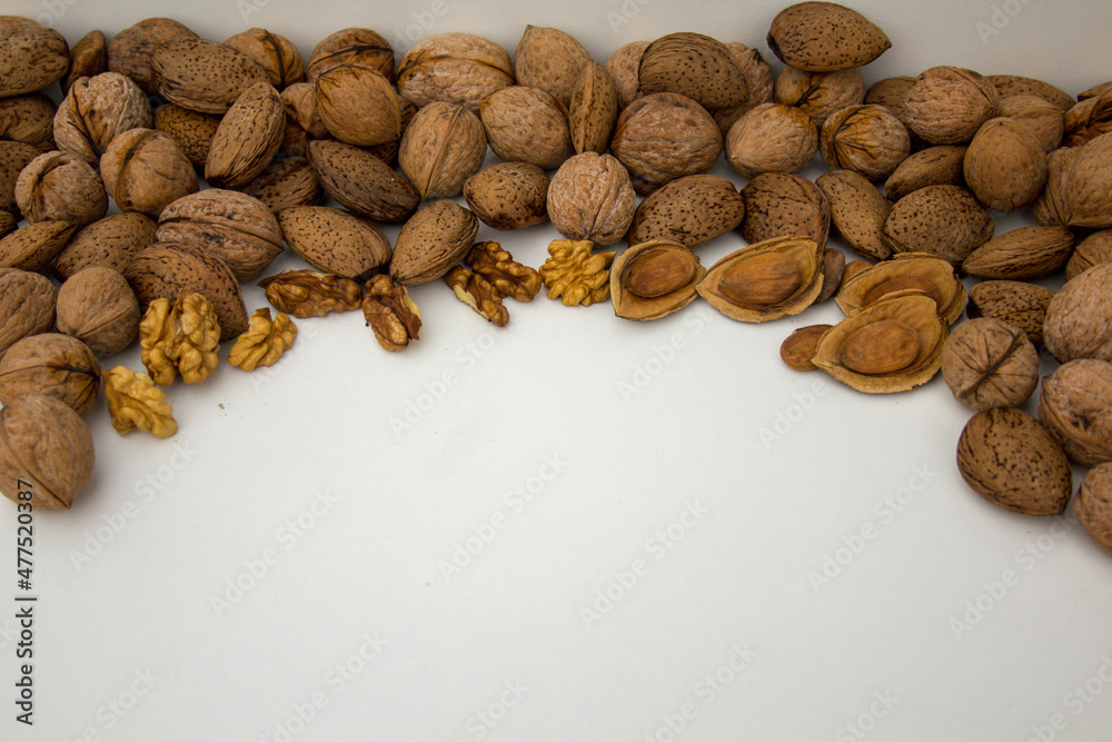 composition of dried fruit, walnuts and almonds with space to insert text composition of dried fruit, walnuts and almonds with space to insert text