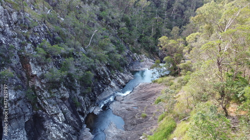 A creek in between mountains. Aerial view