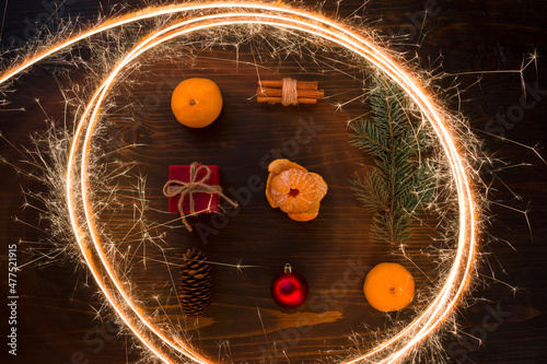 Wallpaper Mural Composition with Christmas ball, gift, cinnamon and tangerines on wooden background, flat lay. Holiday Decoration. Fresh mandarin oranges fruit or tangerines on a wooden table Torontodigital.ca
