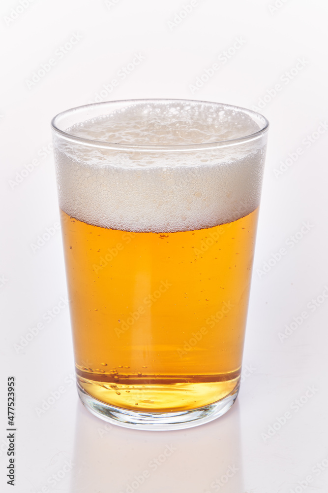 One glass of beer isolated over white background One glass of beer isolated over white background