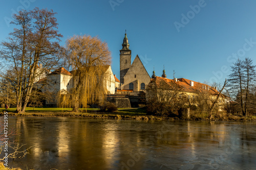 Castle Park and Telc Castle. View of the city of Telc in the winter sunset. The picturesque castle and the historic center with the decorative facades of the houses belong to the UNESCO World Heritage