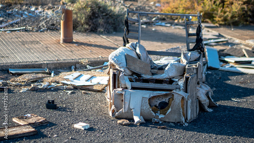 rubble and garbage thrown and abandoned on the street in a vacant lot and abandoned circuit in the canary islands with unrecycled garbage and construction materials cables, thermo photo