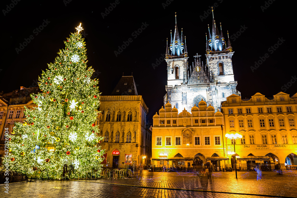 Fototapeta premium Prague, Czech republic - December 29, 2021. Night photo of Old Town Square without Christmas markets banned due Coronavirus caused empty streets without tourists