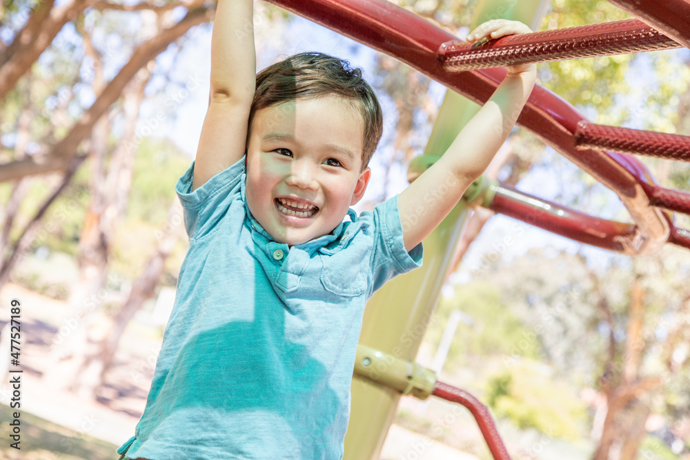 Chinese and Caucasian Boy Having Fun At The Playground. Chinese and Caucasian Boy Having Fun At The Playground.