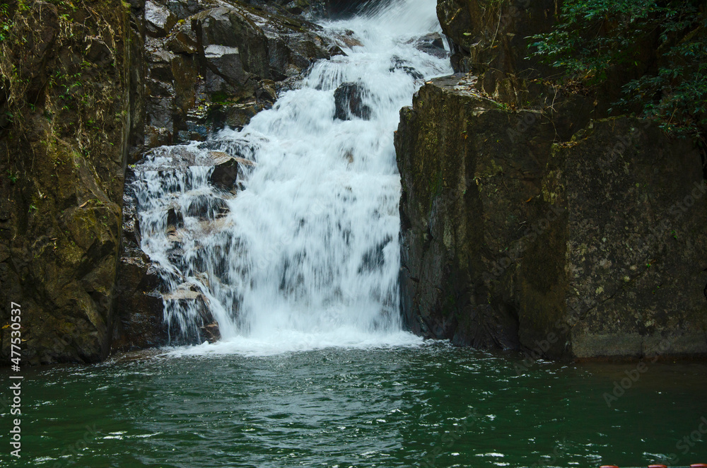 Beautiful white waterfall on high rock cliff Beautiful white waterfall on high rock cliff