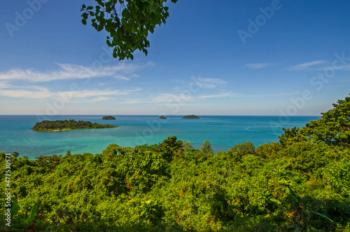 Green forest and blue sea with sky background at Chang island in Thailand