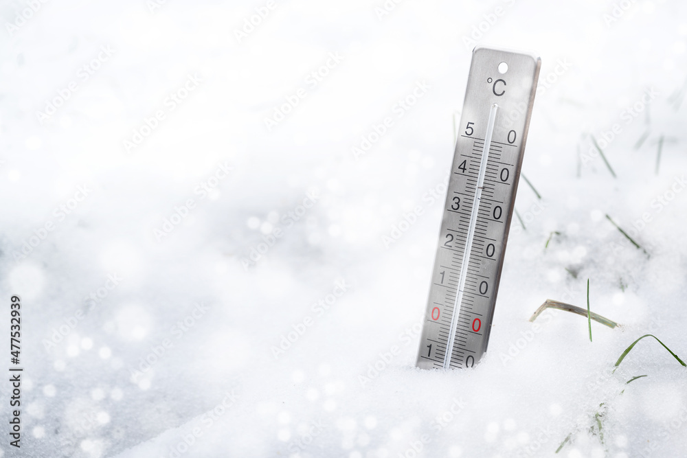 Thermometer in the snow during a cold snap in winter, concept for weather phenomena, climate change and rising heating costs, copy space, selected focus Thermometer in the snow during a cold snap in winter, concept for weather phenomena, climate change and rising heating costs, copy space, selected focus