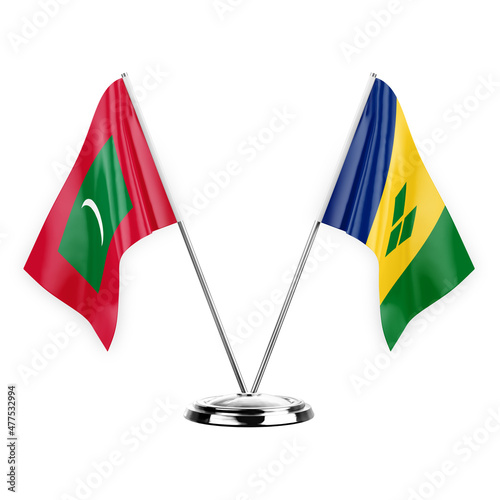 Two table flags isolated on white background 3d illustration, maldives and saint vincent and the grenadines