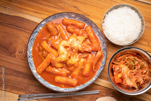 Tteokbokki with spicy sauce Korean traditional food, Tteokbokki is Korean rice cake stick with cheese in spicy sauce Korean cuisine dish.