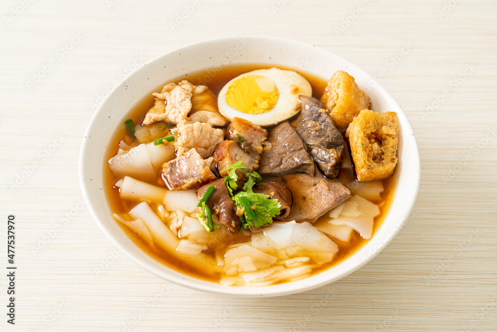 paste of rice flour or boiled Chinese pasta square in clear soup paste of rice flour or boiled Chinese pasta square in clear soup