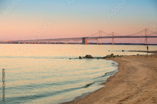 chesapeake bay bridge with calm inlet at sunset photo