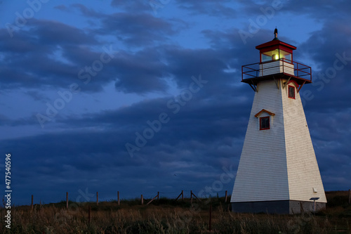 post sunset blue hour lighthouse on cliff