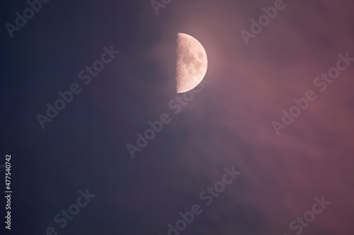 half moon in purple sky