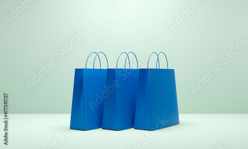 Three blue shopping bags on blue background. 3d Render