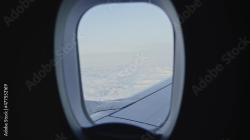 Sea of clouds view from air flight Boeing in to the cloudy sky, travel holiday concept photo