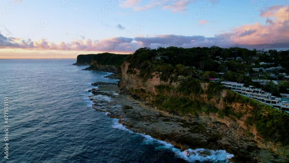 Summer sunrise seascape with clouds at Avoca Beach on the Central Coast, NSW, Australia. Summer sunrise seascape with clouds at Avoca Beach on the Central Coast, NSW, Australia.