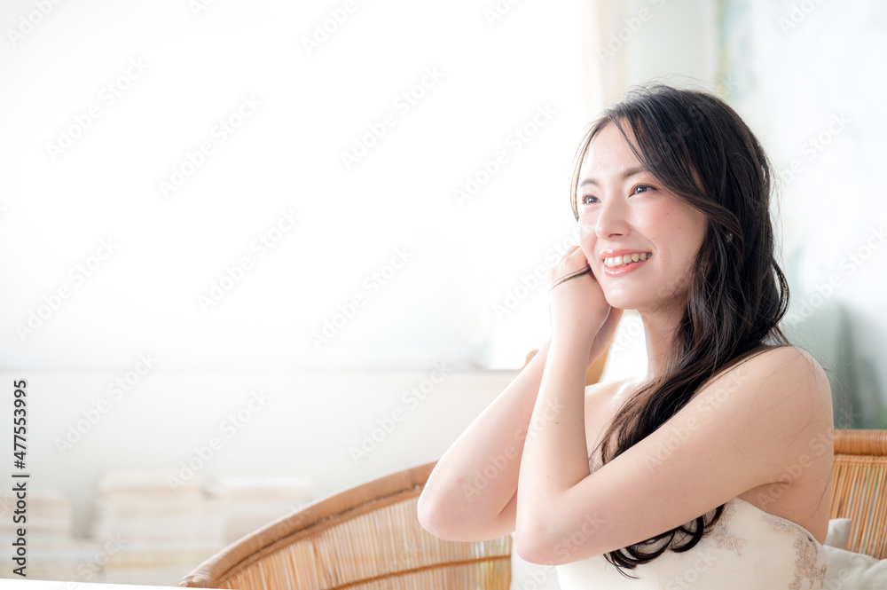 Asian bride changing her earrings. Copy space available. Asian bride changing her earrings. Copy space available.