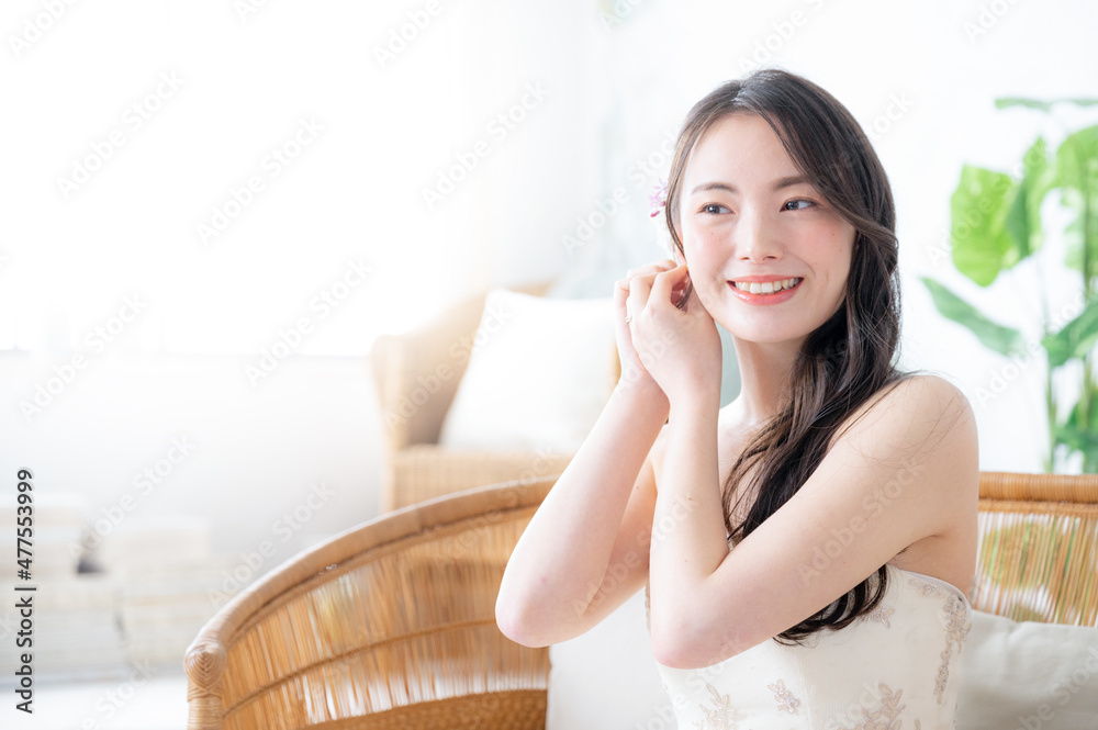 Asian bride changing her earrings. Copy space available. Asian bride changing her earrings. Copy space available.