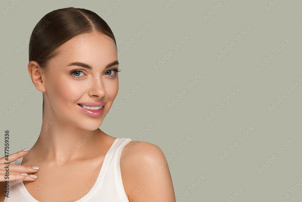 Beauty healthy skin women touching face cosmetic studio portrait. Sportswear color background green Beauty healthy skin women touching face cosmetic studio portrait. Sportswear color background green