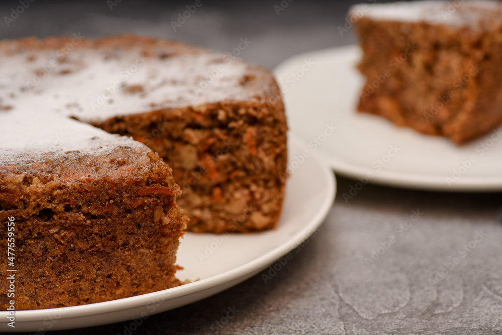 Carrot and nuts oil cake sprinkled with sugar powder Carrot and nuts oil cake sprinkled with sugar powder