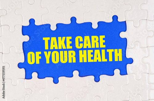 Inside the white puzzles on a blue background it is written - Take care of your health