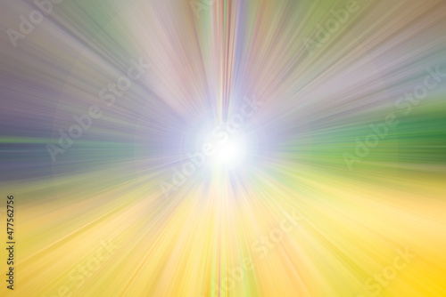 Bright flash of light with yellow, green and purple rays