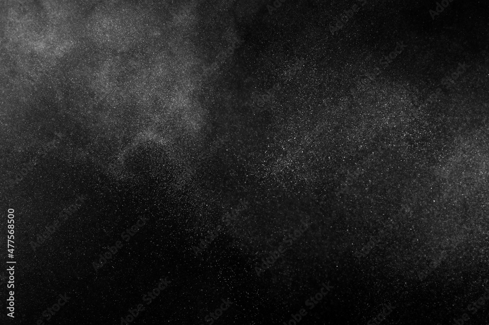 White powder explosion on black background. Abstract white dust texture. White powder explosion on black background. Abstract white dust texture.