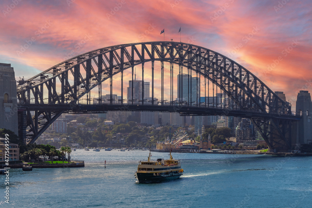 Fototapeta premium View of Sydney Harbour NSW Australia. Ferry boats partly cloudy colourful skies blue waters