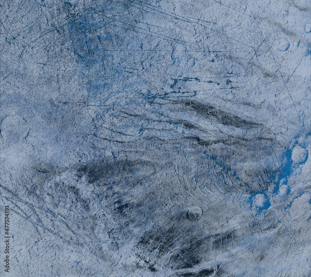 Naklejka premium Frozen ground texture. Ice and snow. Cold surface during winter.