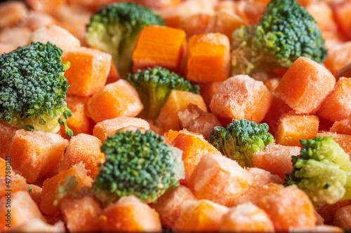 Frozen carrots broccoli pieces closeup background