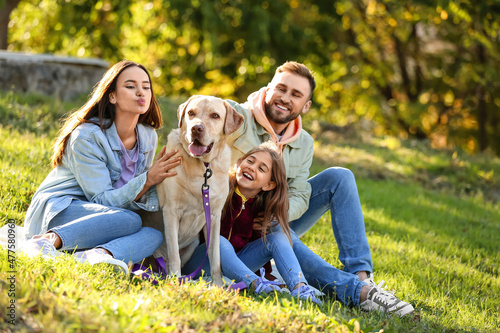 Happy family with Labrador ...