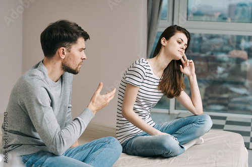man and woman at home conflict quarrel discontent