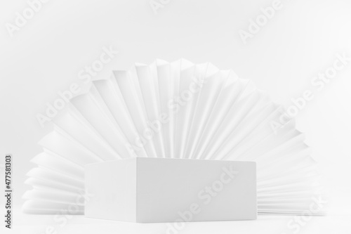 White abstract modern simple scene with one rectangle box podium mockup for presentation of cosmetic product  advertising  design with light oriental folds paper fan in chinese style  corner  3d.