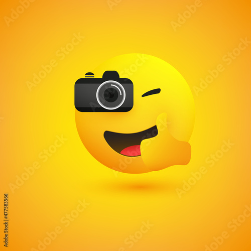 Simple Shiny Happy Smiling Photographer Emoji Taking Picture with a Digital Camera and Showing Thumbs Up - Emoticon on Yellow Background