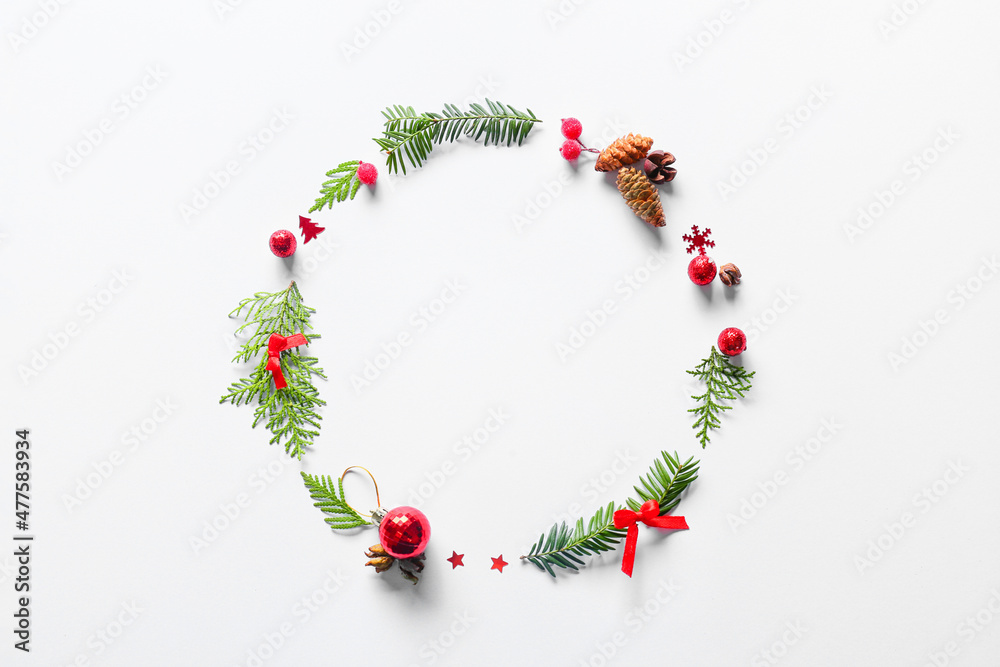 Frame made of fir branches and Christmas decor on white background