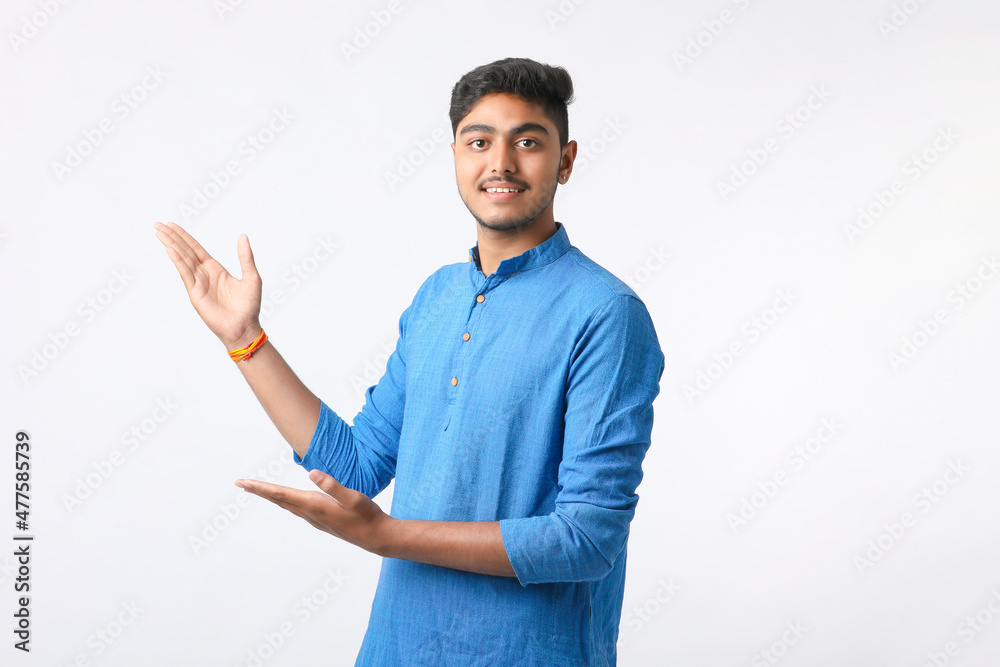 Indian man in tradition wear and giving expression on white background. Indian man in tradition wear and giving expression on white background.