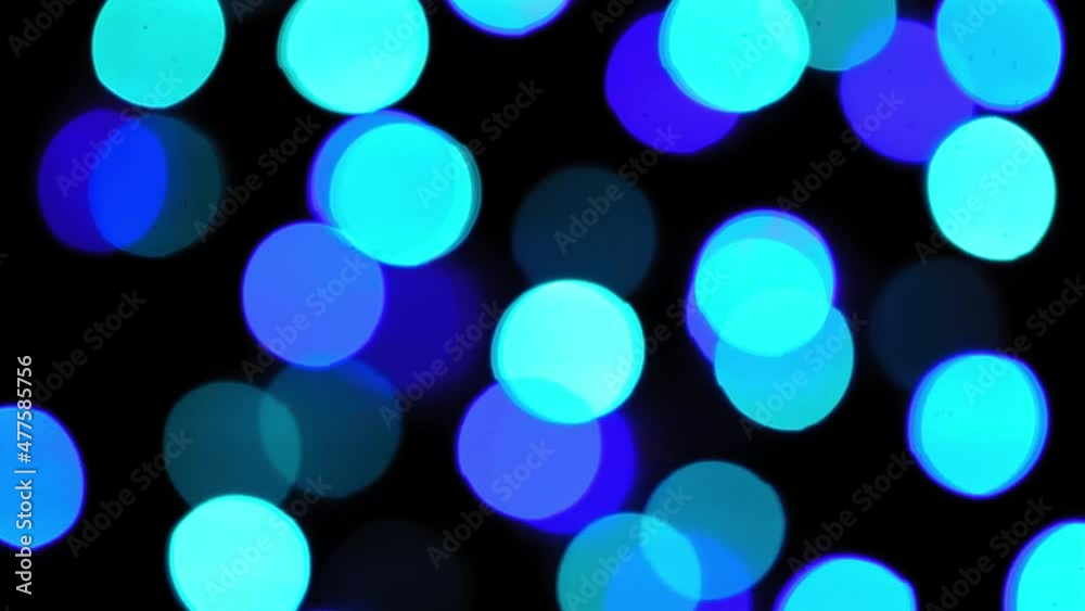 4k. Christmas mood, round defocused multicolored lights. Beautiful New Year screensaver. Merry christmas congratulation. Abstract background of glowing garlands at night. Christmas Garland 4k. Christmas mood, round defocused multicolored lights. Beautiful New Year screensaver. Merry christmas congratulation. Abstract background of glowing garlands at night. Christmas Garland