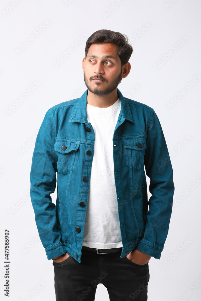 Young indian man giving expression on white background. Young indian man giving expression on white background.