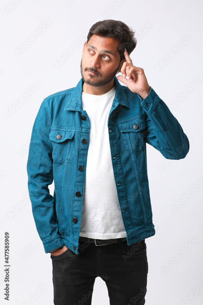 Young indian man giving expression on white background. Young indian man giving expression on white background.