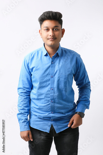 Young indian college student giving expression on white background.