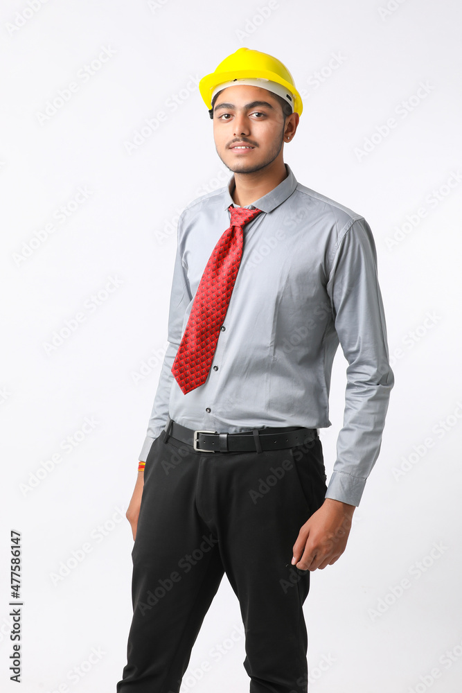 Young Indian engineer wearing yellow color hard hat and giving successful gesture. Young Indian engineer wearing yellow color hard hat and giving successful gesture.
