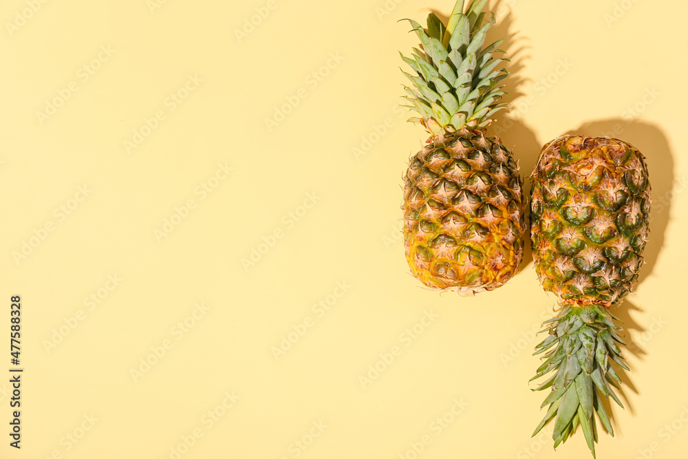 Two fresh pineapples on color background Two fresh pineapples on color background