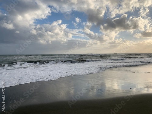 Amazing sky reflection at the sea coast  sand beach  evening time  natural background