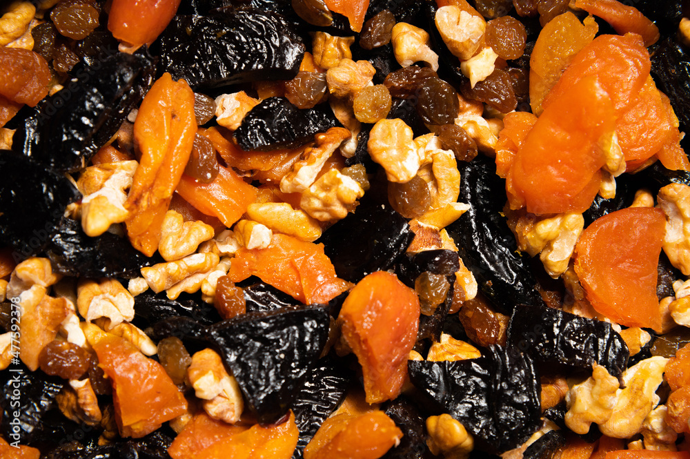 Close-up of a mixture of various dried fruits and nuts. Healthy food and snack Close-up of a mixture of various dried fruits and nuts. Healthy food and snack